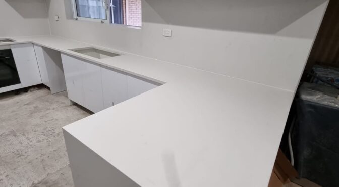 New Kitchen and stone benchtop with waterfall